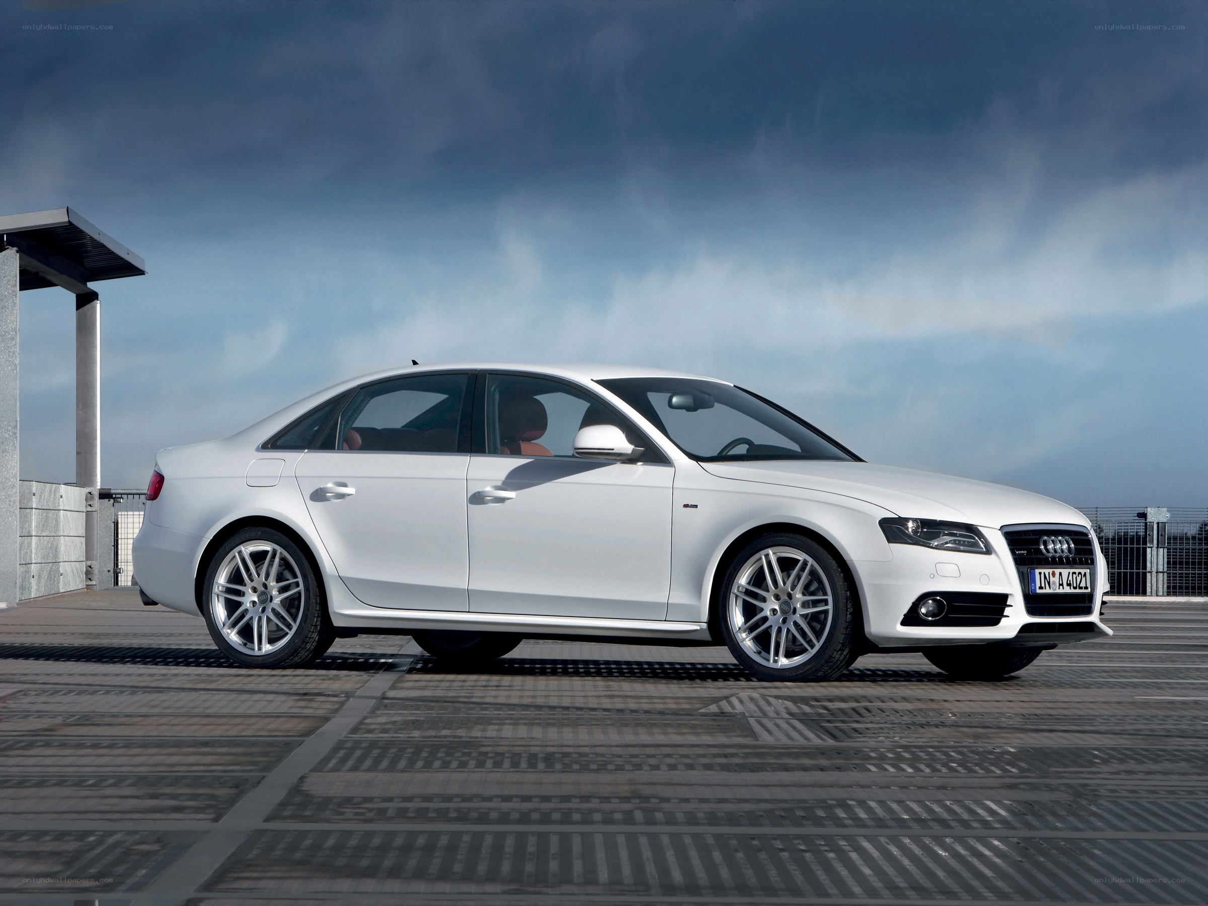 white audi sedan on rooftop