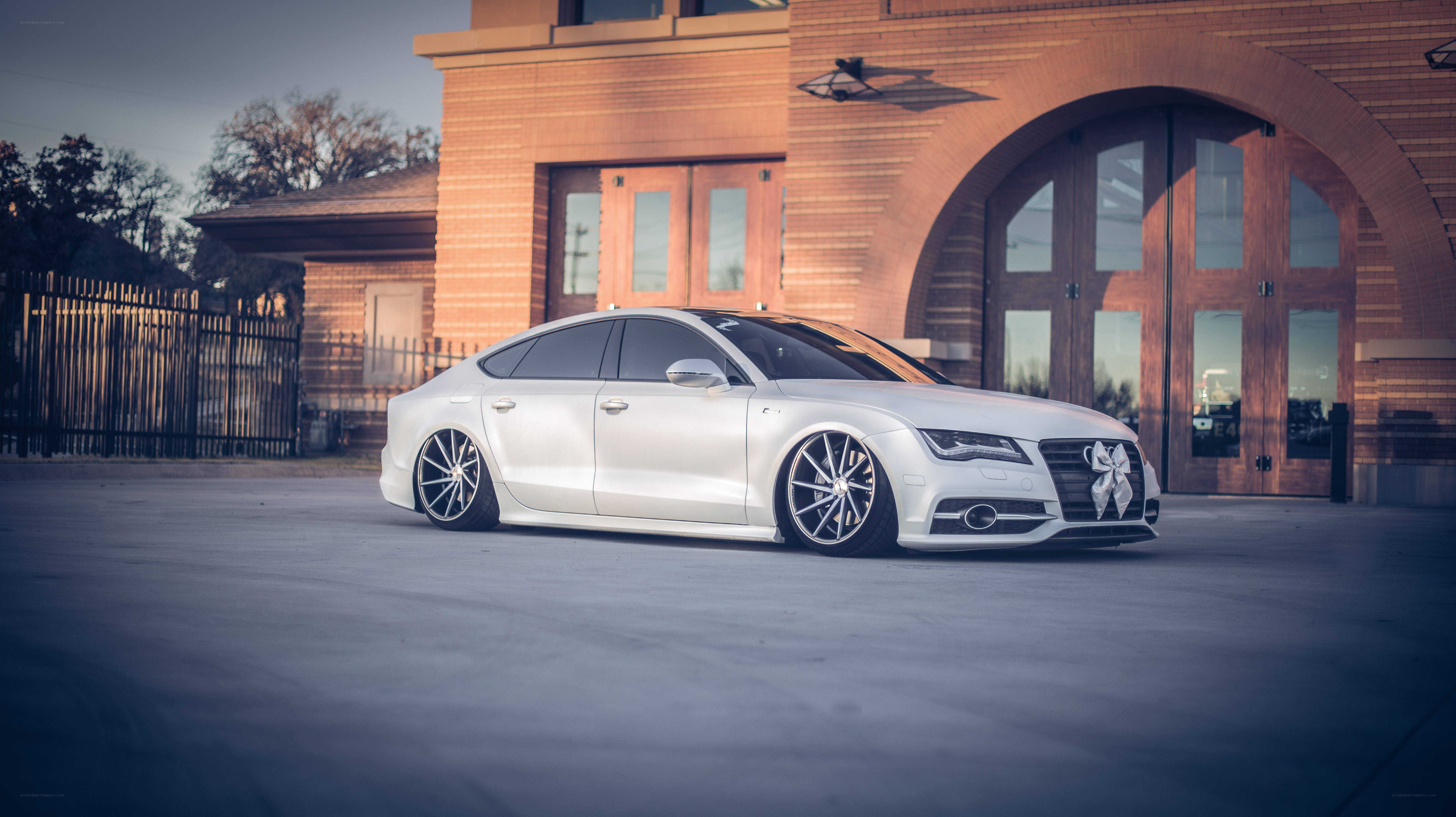 white audi sedan parked outside