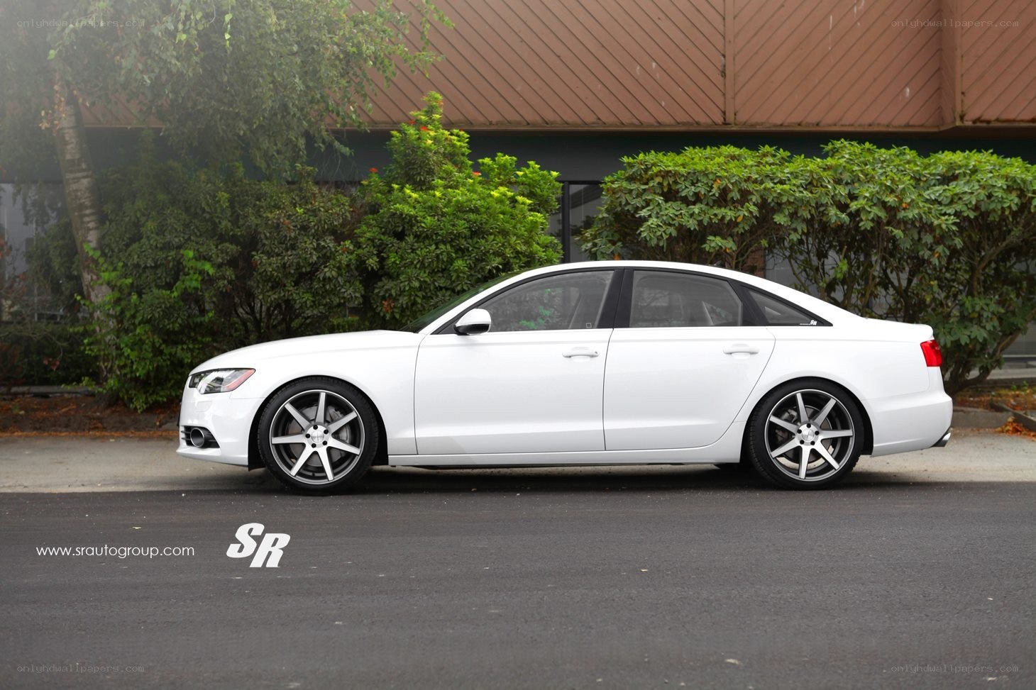 white audi sedan with custom wheels