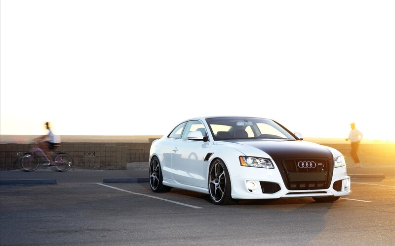 White Audi sports car at sunset