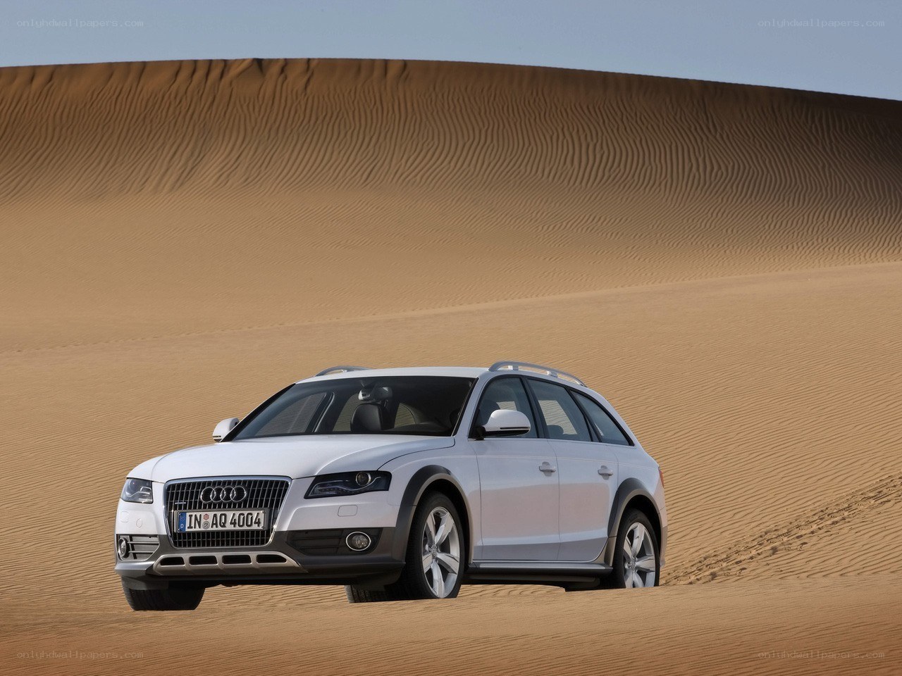 White Audi station wagon in desert