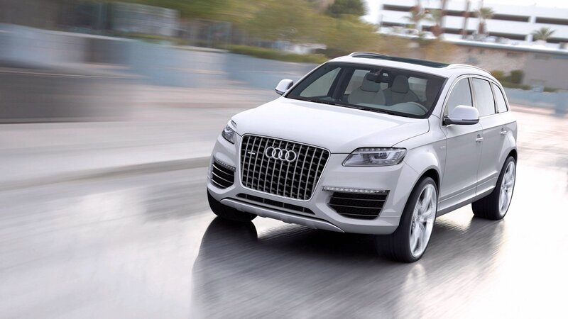 White Audi SUV in motion
