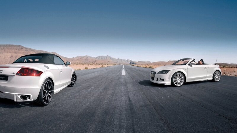 White Audi TT cars on desert road