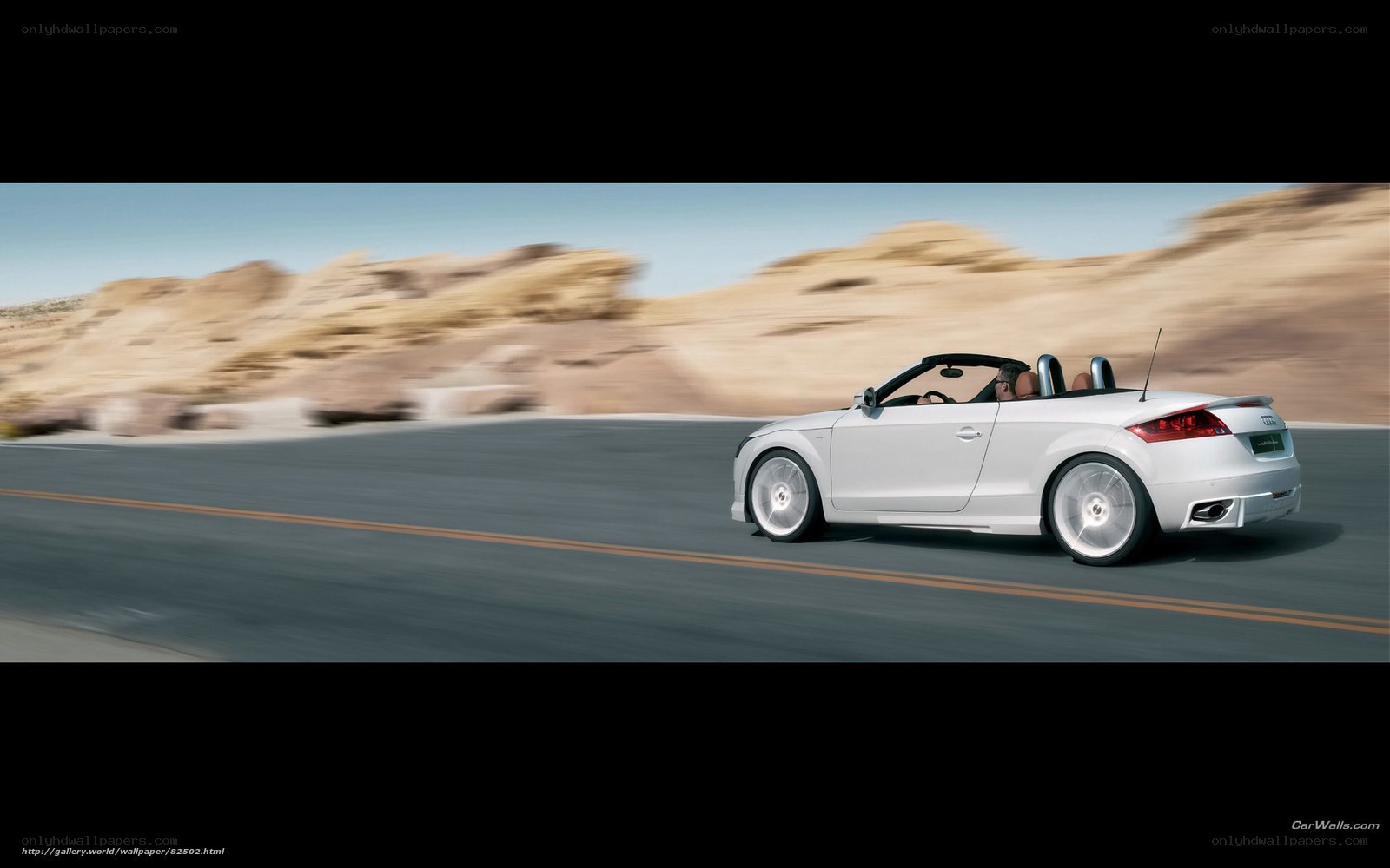 White Audi TT Roadster in motion