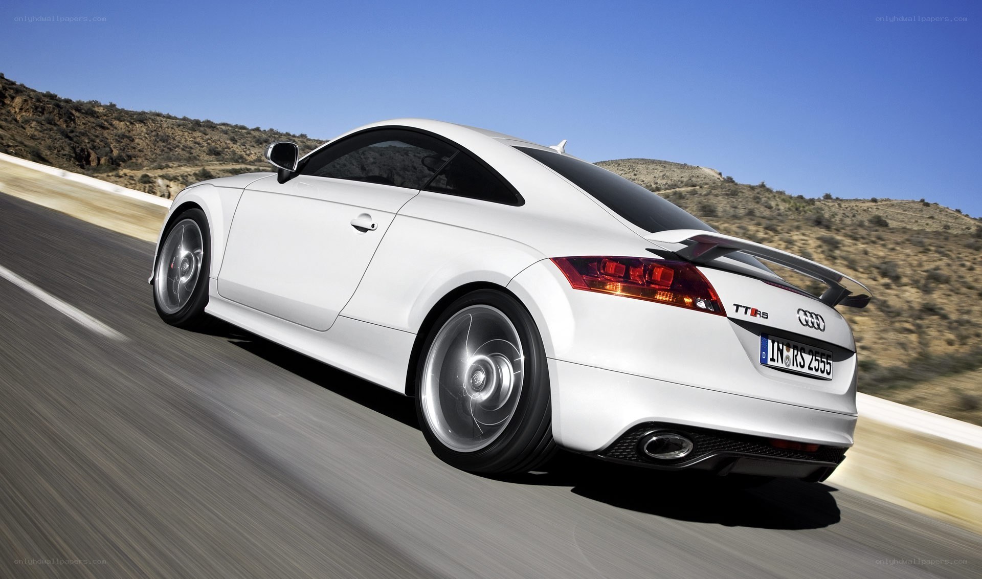 White Audi TT RS in motion