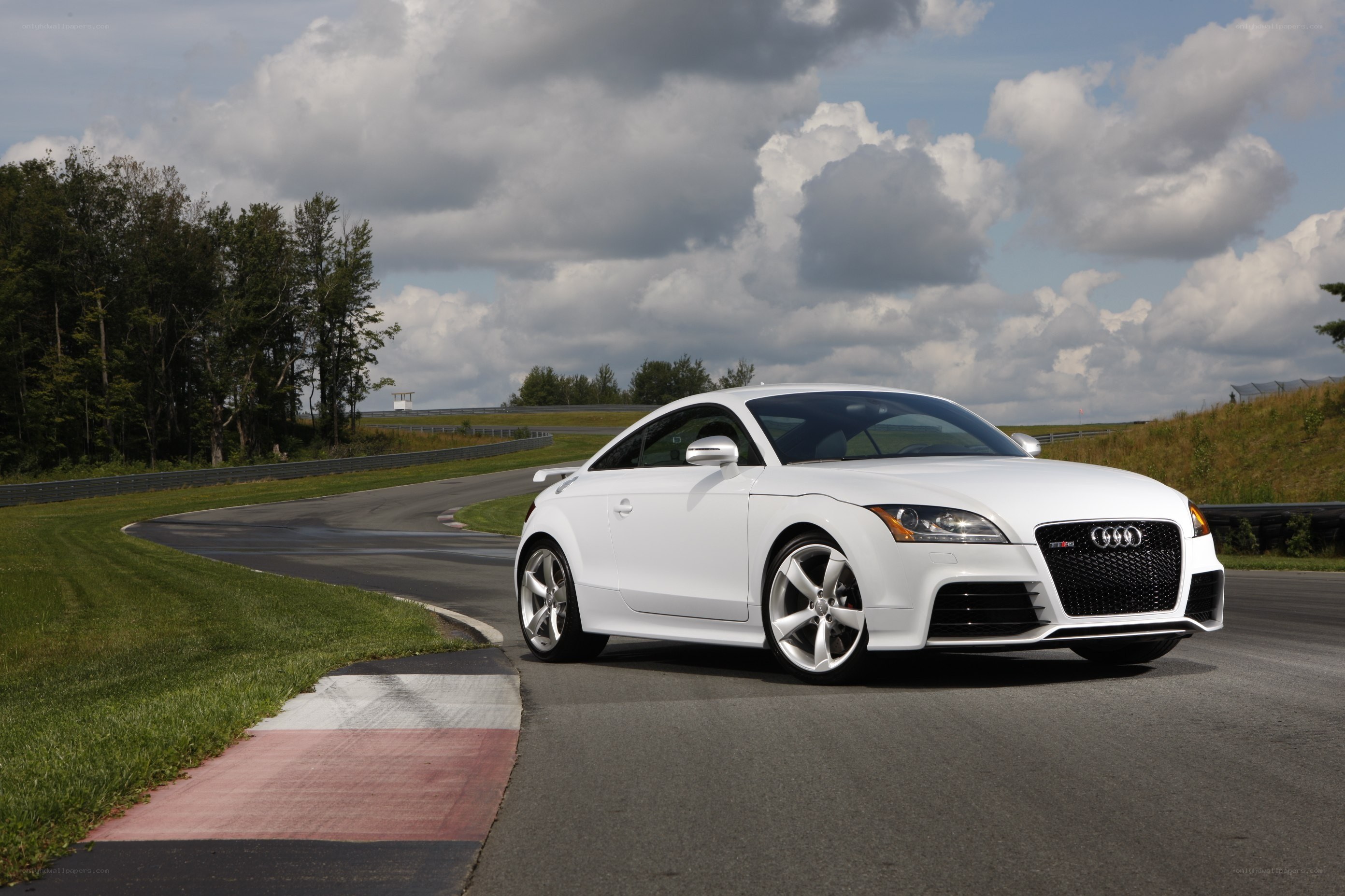 White Audi TT-RS on a racetrack