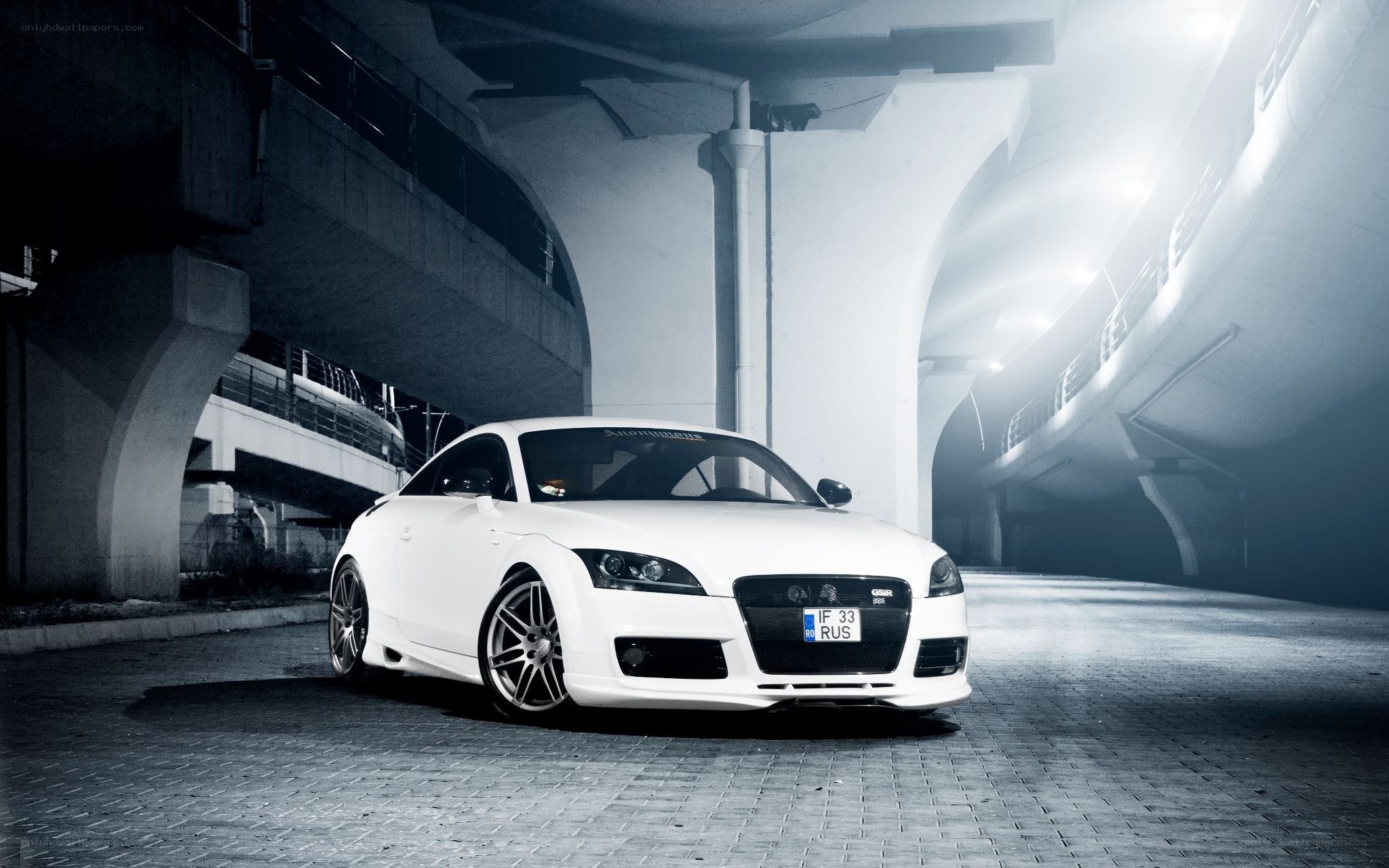 White Audi TT under a bridge
