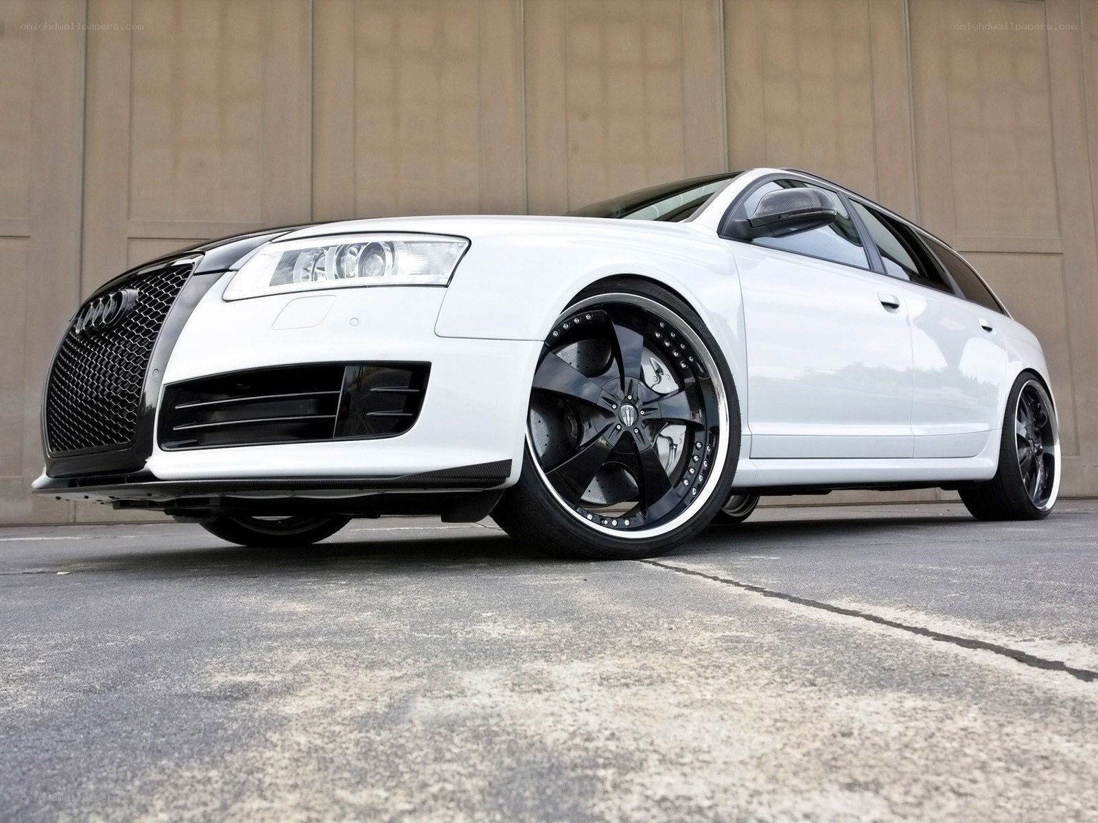 white audi with custom wheels