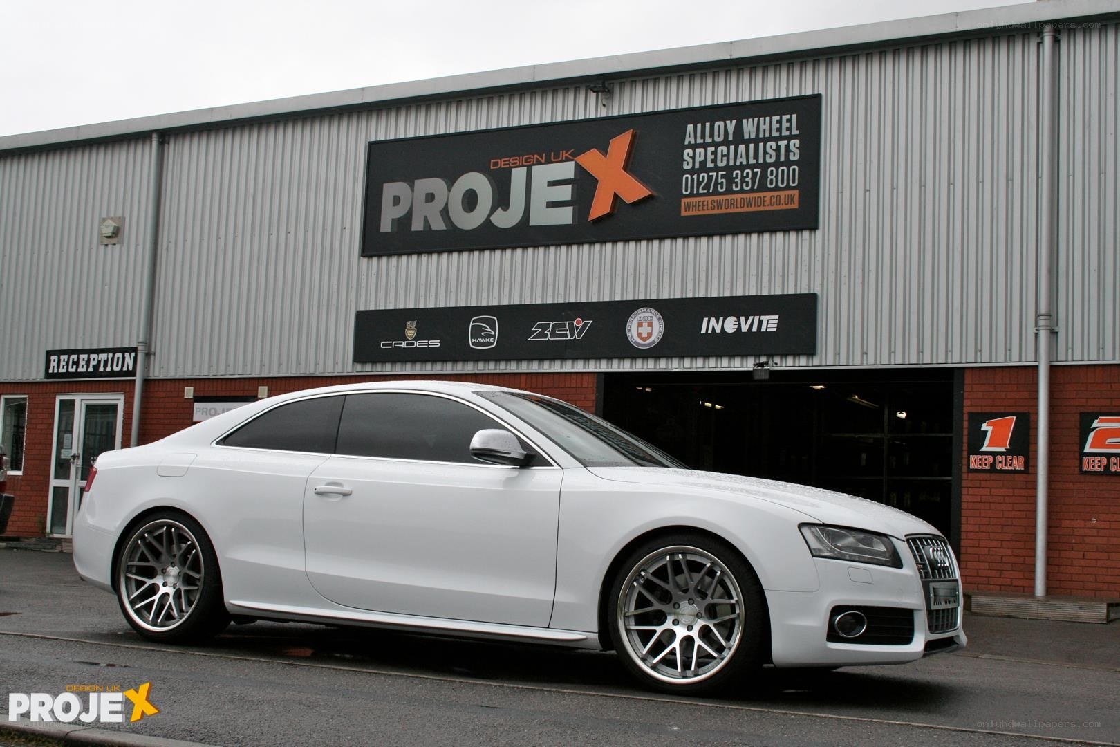 White Audi with custom wheels