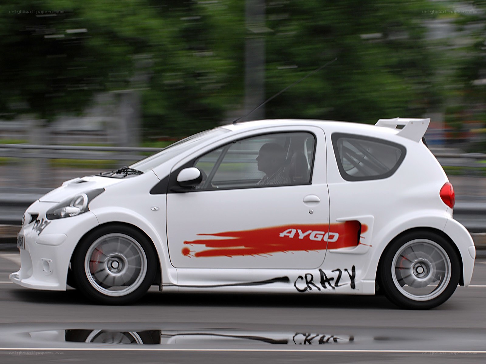 White Aygo racing car in motion