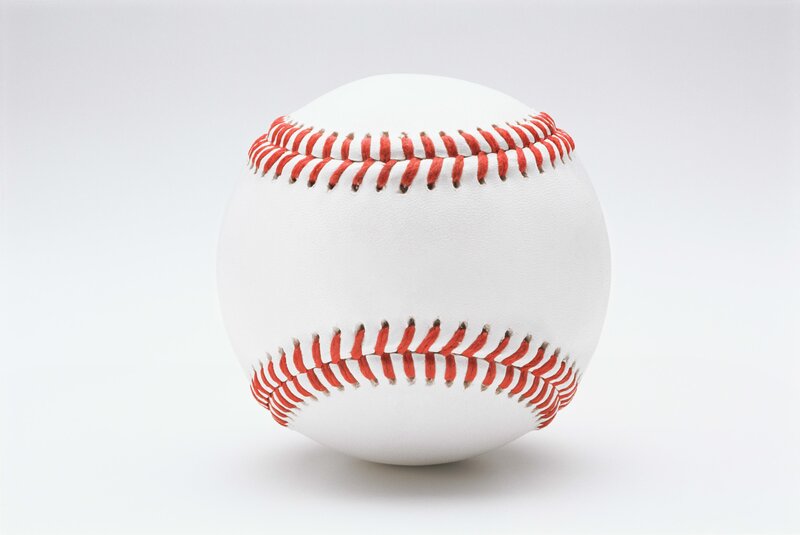 white baseball with red stitching