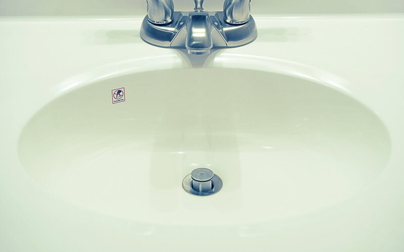 white bathroom sink with faucet