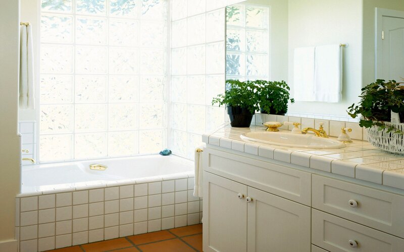 White bathroom with bathtub and sink
