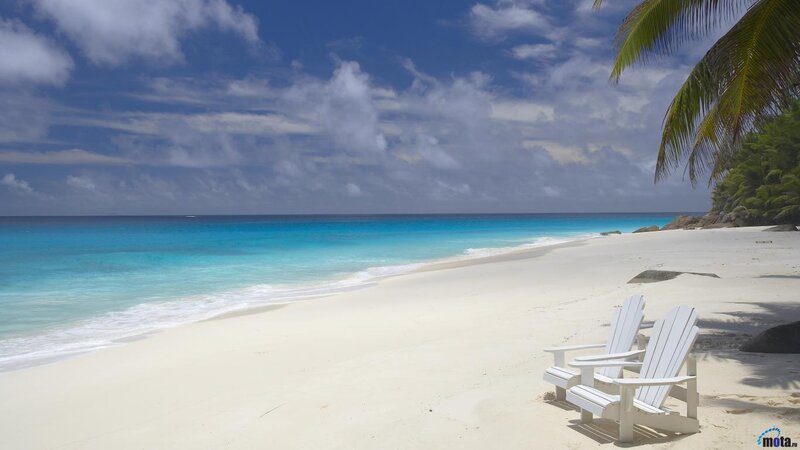 White Beach Chairs on Sand