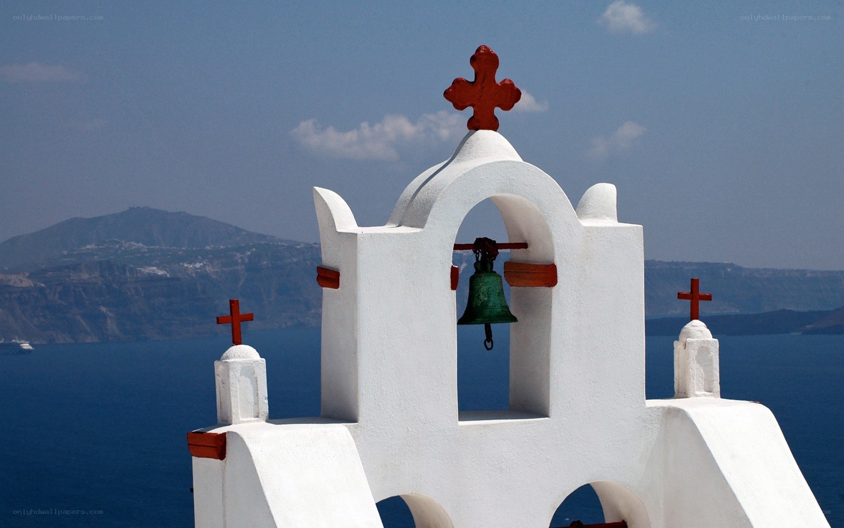 White bell tower with red crosses