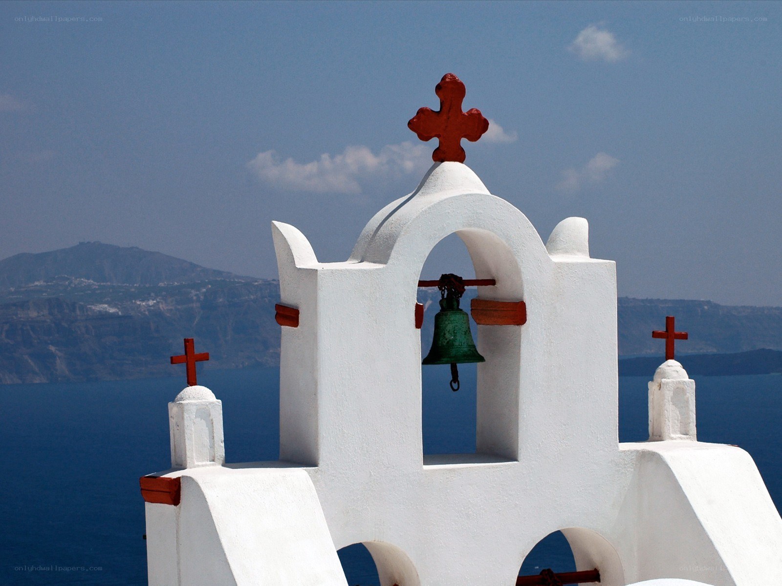 White bell tower with red crosses