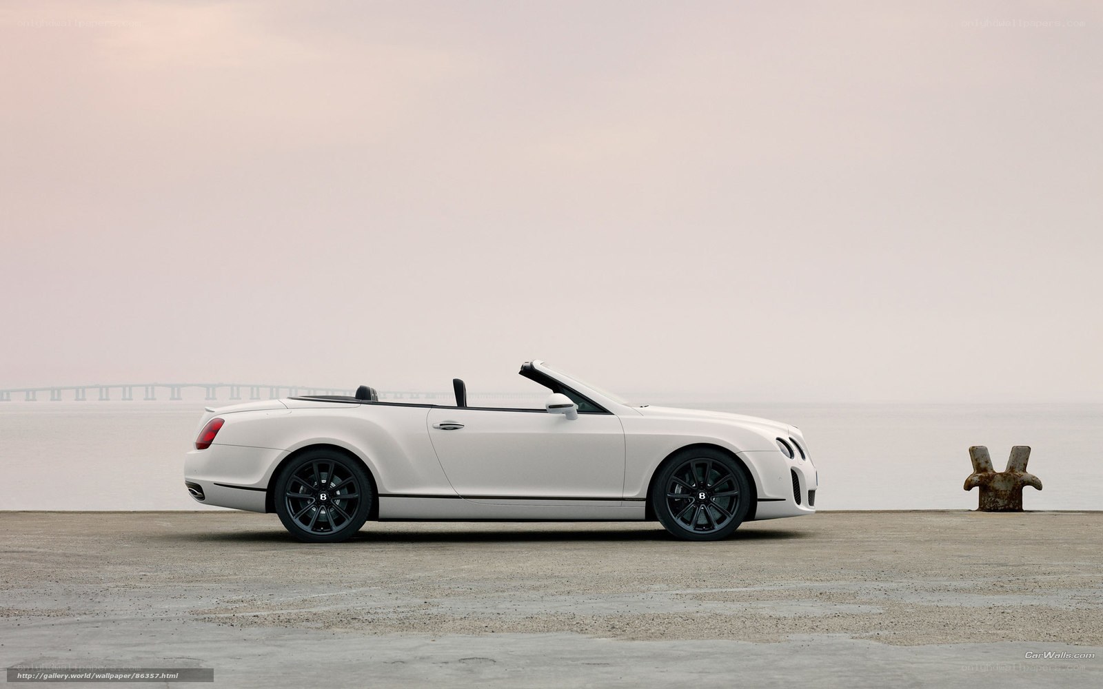 White Bentley convertible by the sea