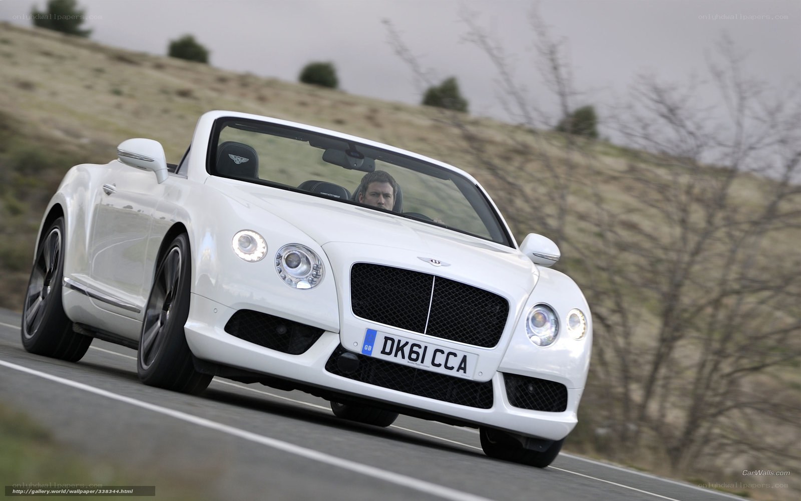 white bentley convertible driving