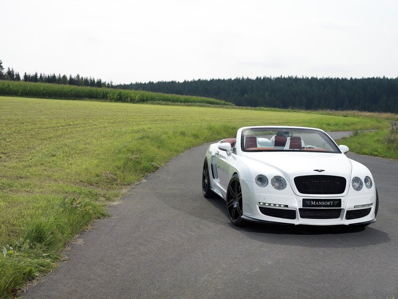 White Bentley convertible on country road