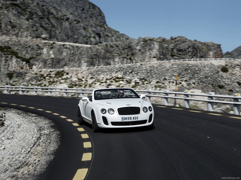 White Bentley convertible on mountain road
