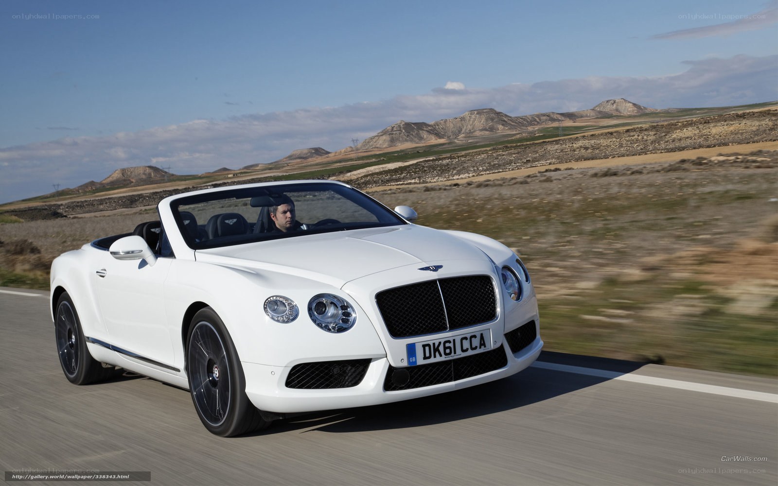 White Bentley convertible on road