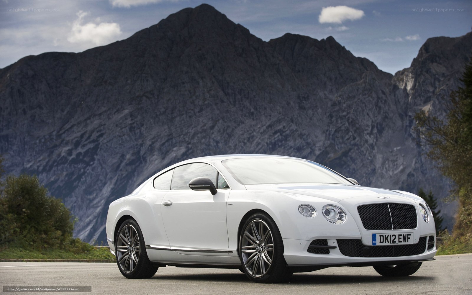 White Bentley coupe on mountain road