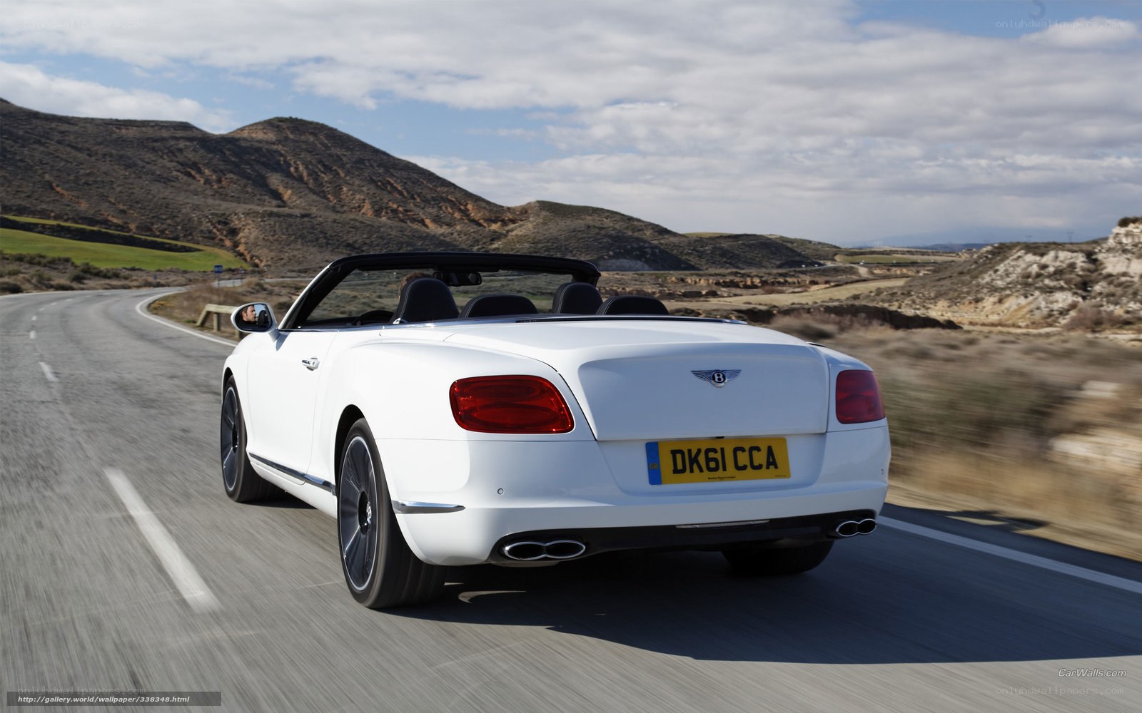 white bentley driving on road
