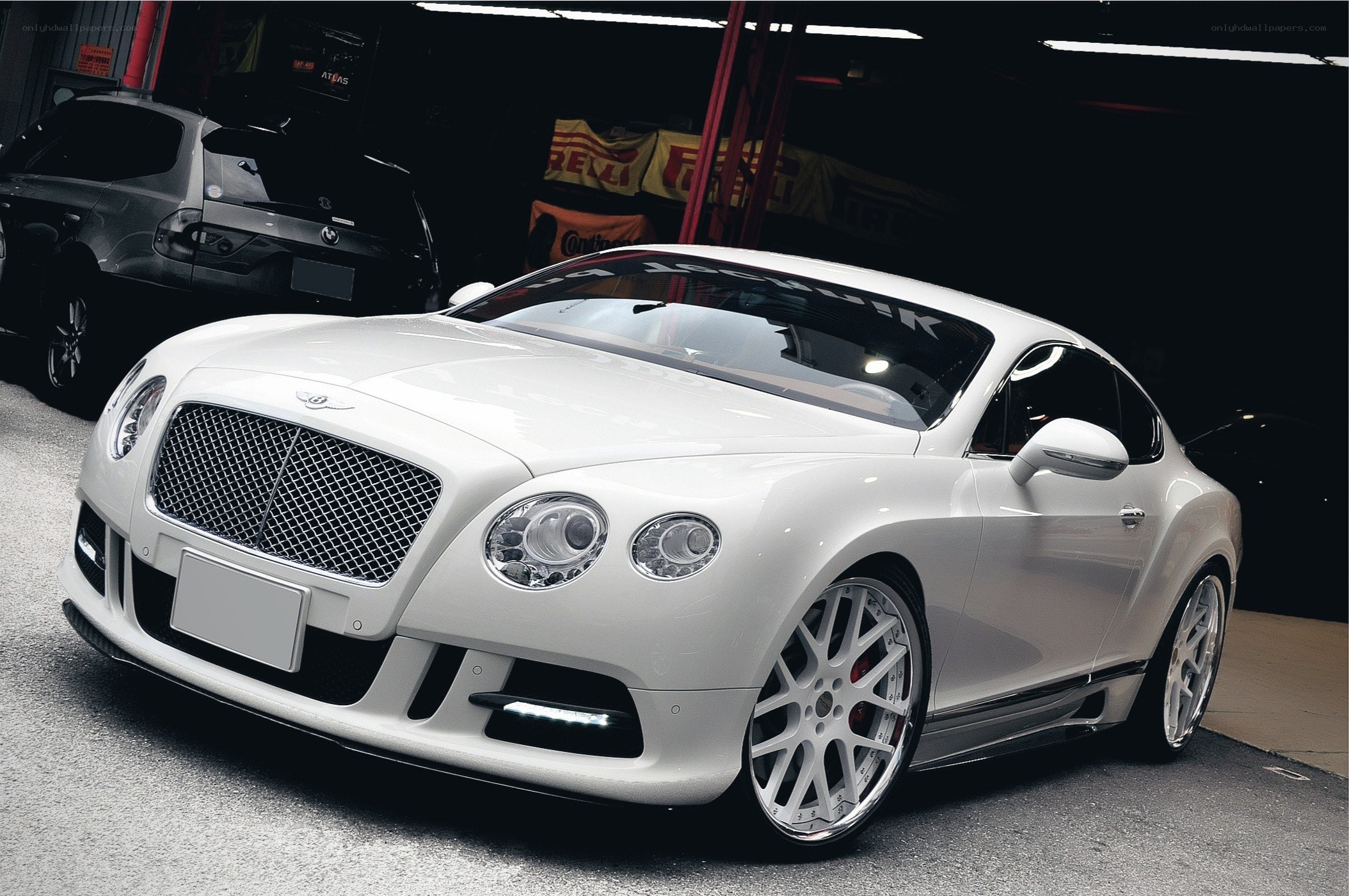 White Bentley in a garage