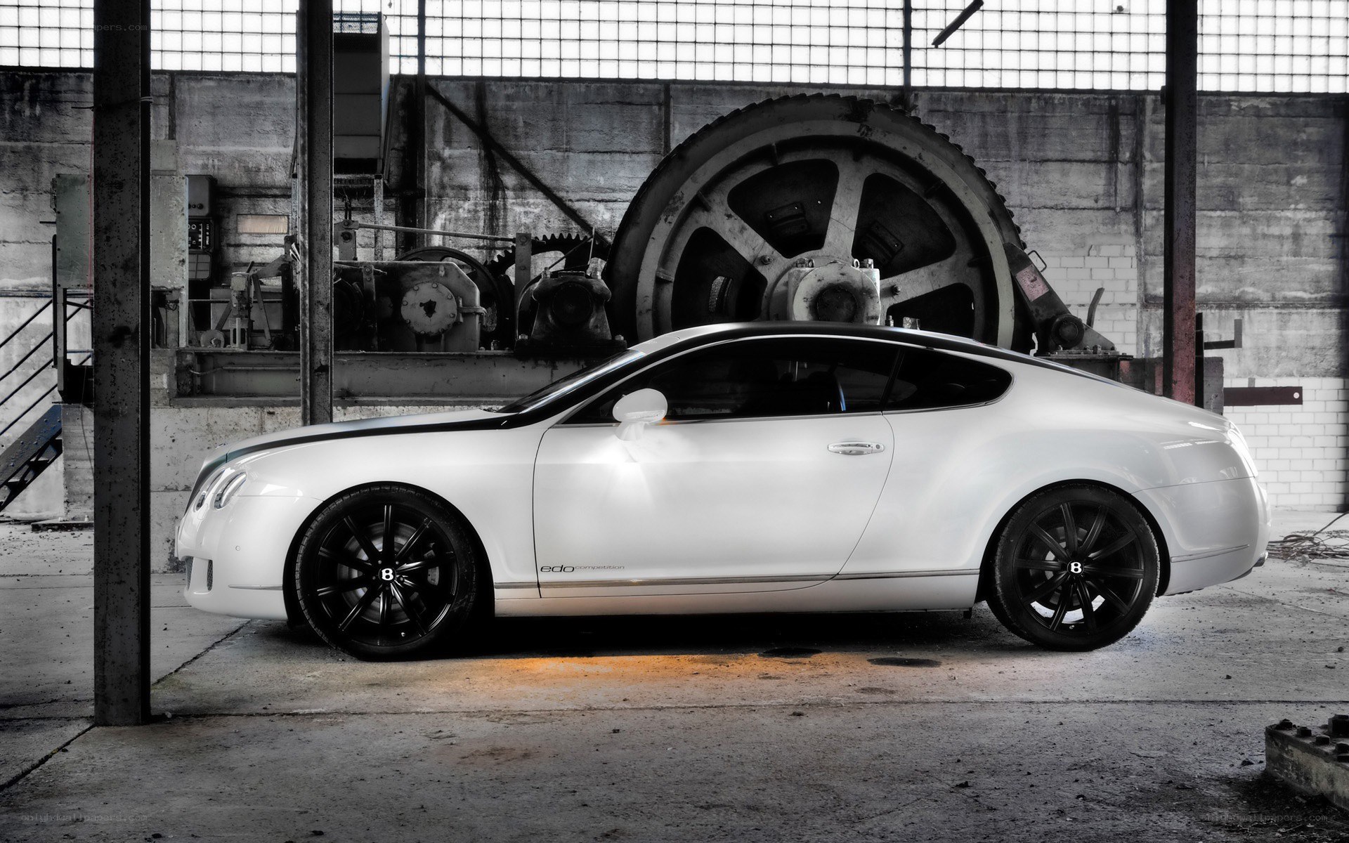 White Bentley in industrial setting
