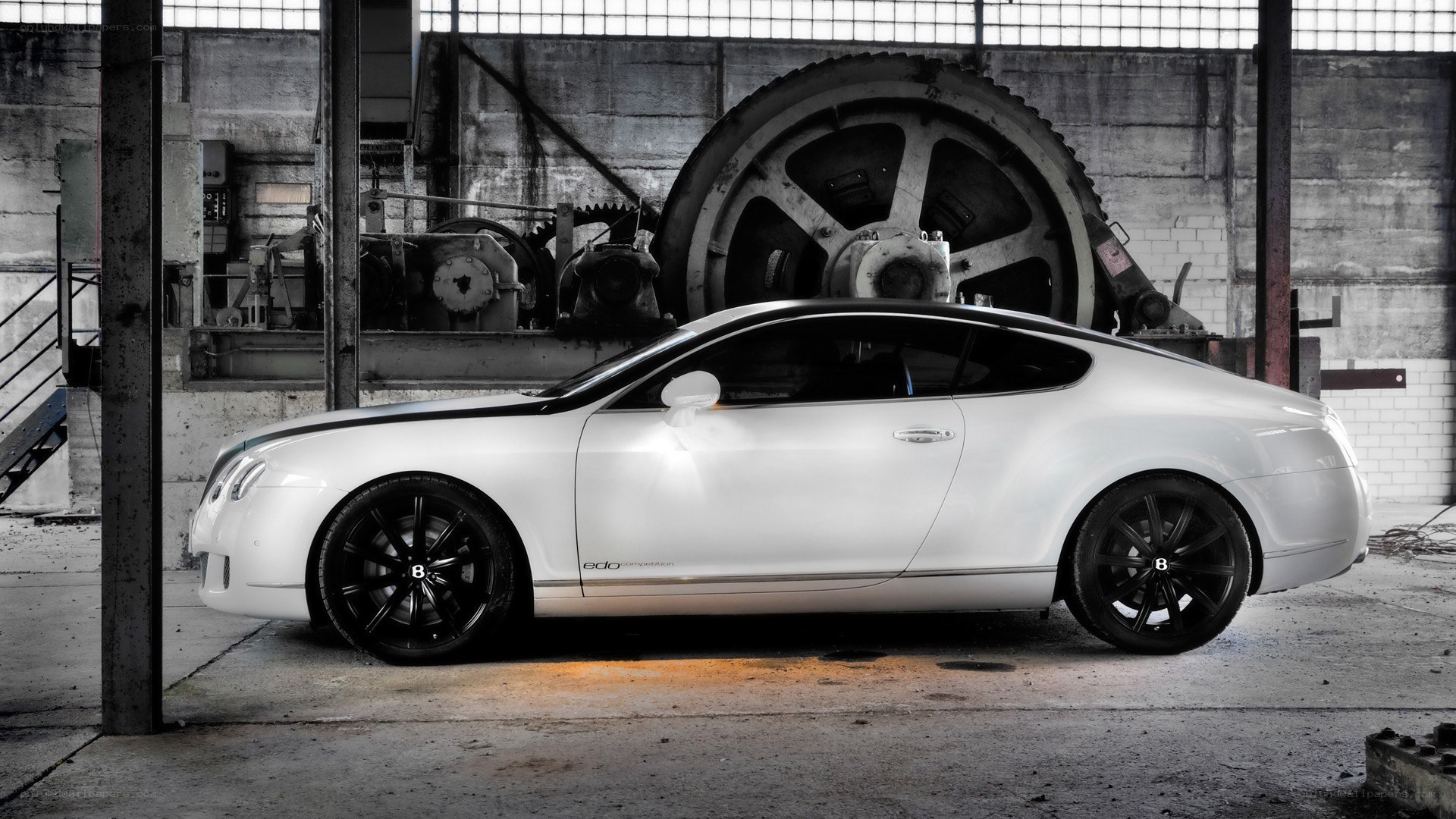 White Bentley in industrial setting