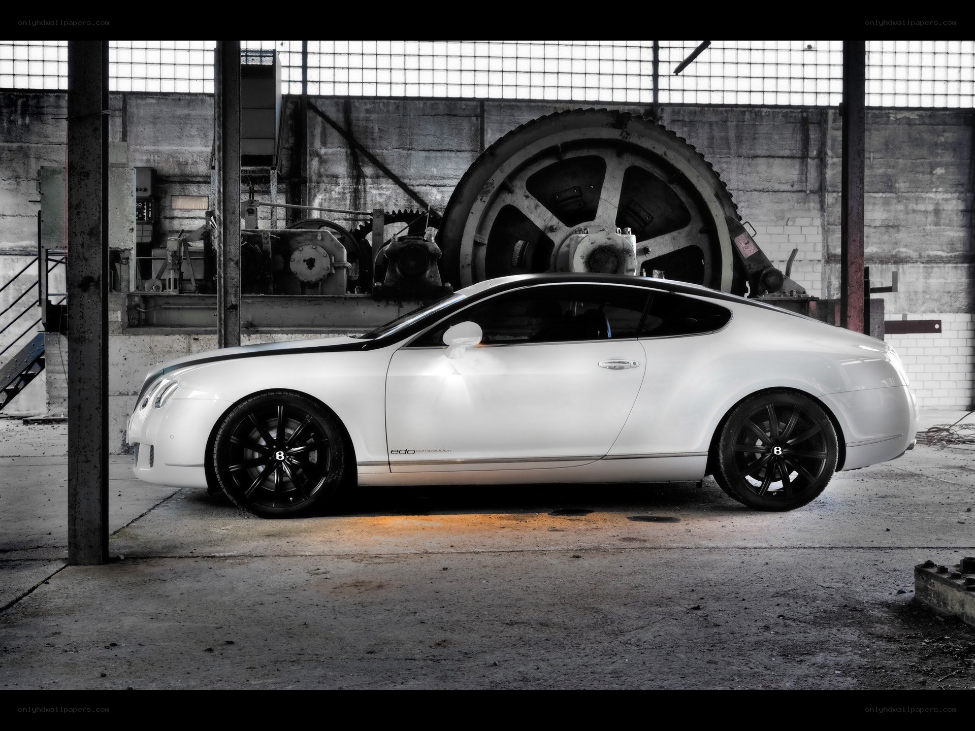 White Bentley in industrial setting