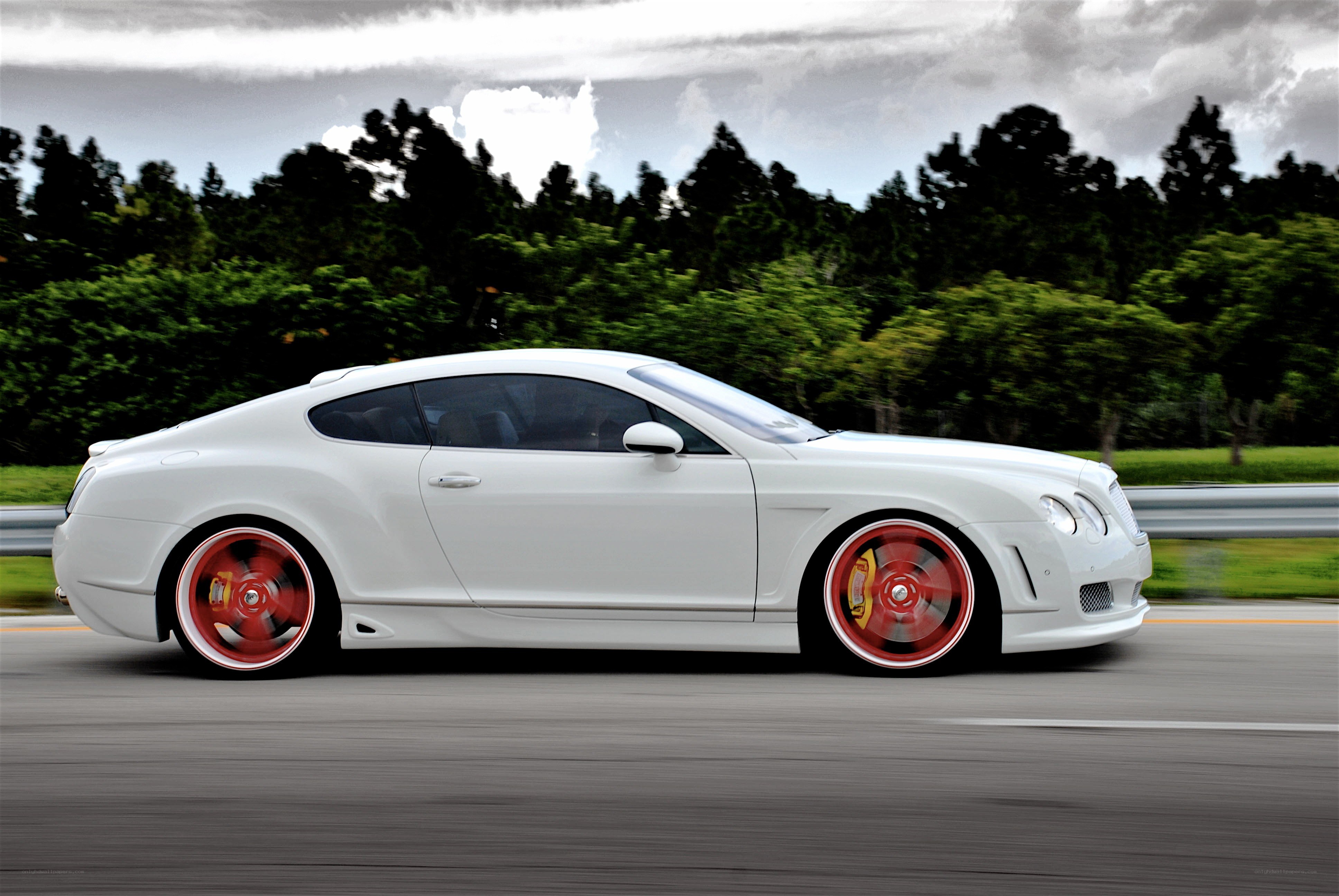 white bentley in motion
