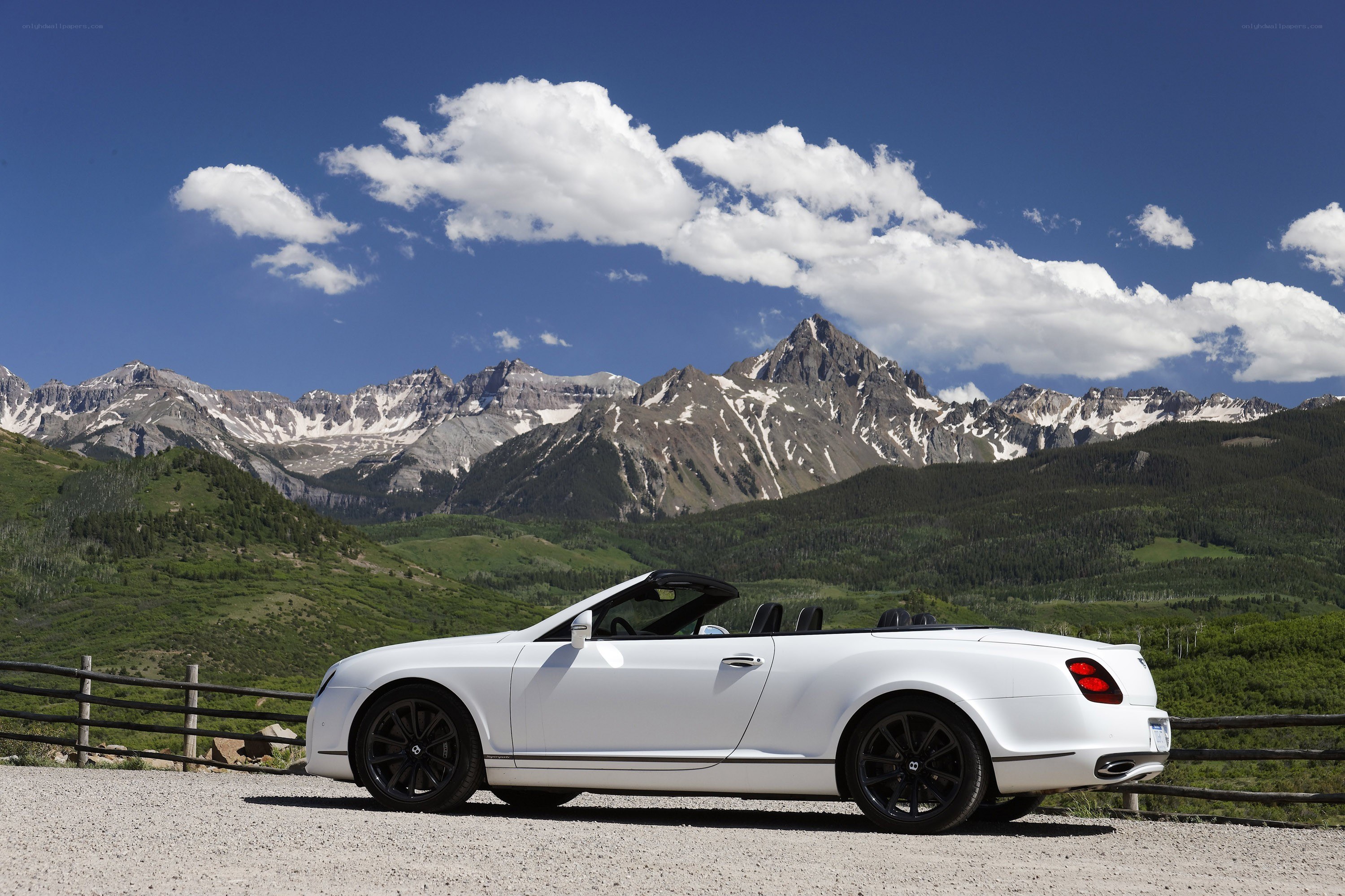 White Bentley in mountain landscape