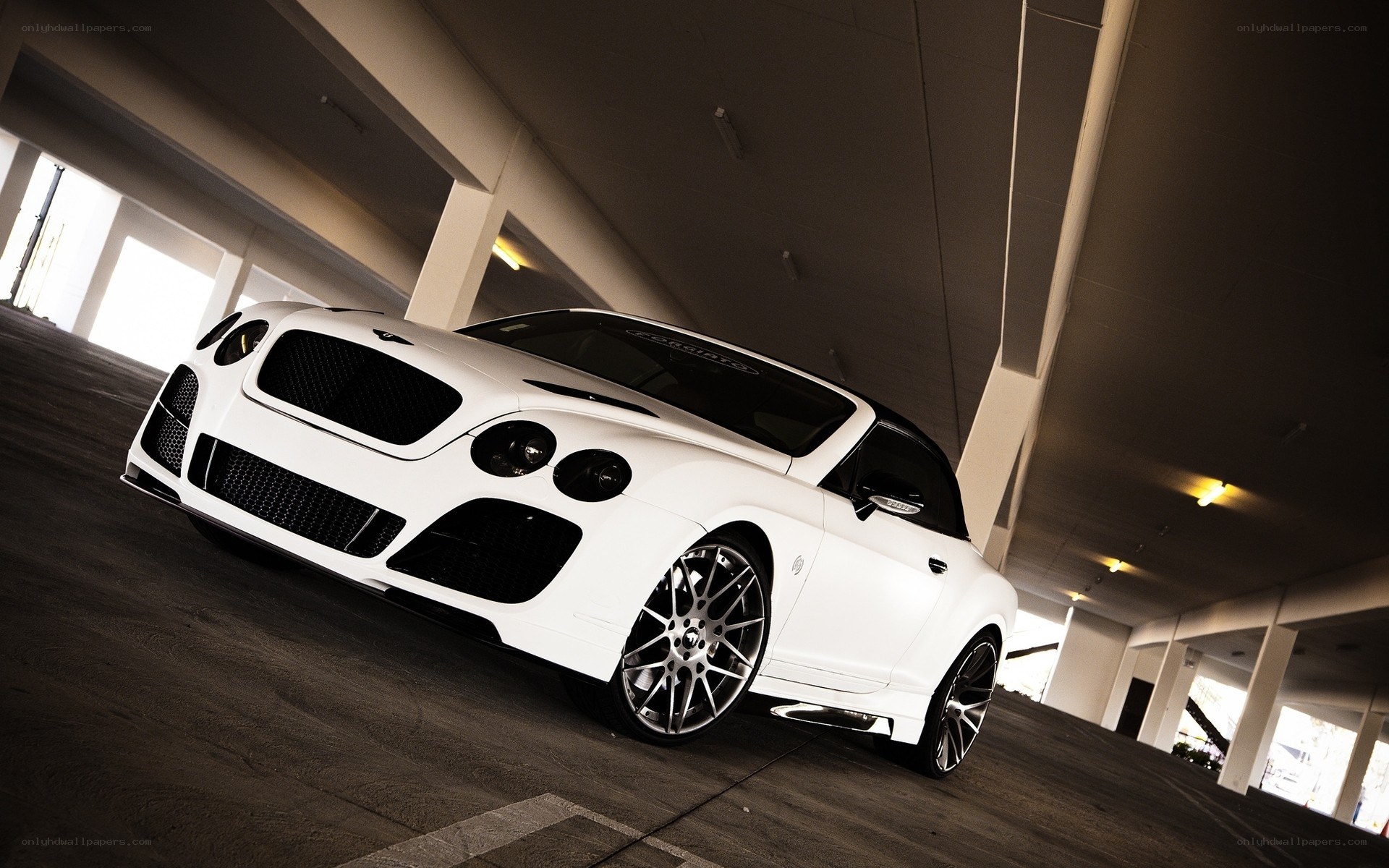 White Bentley in parking garage
