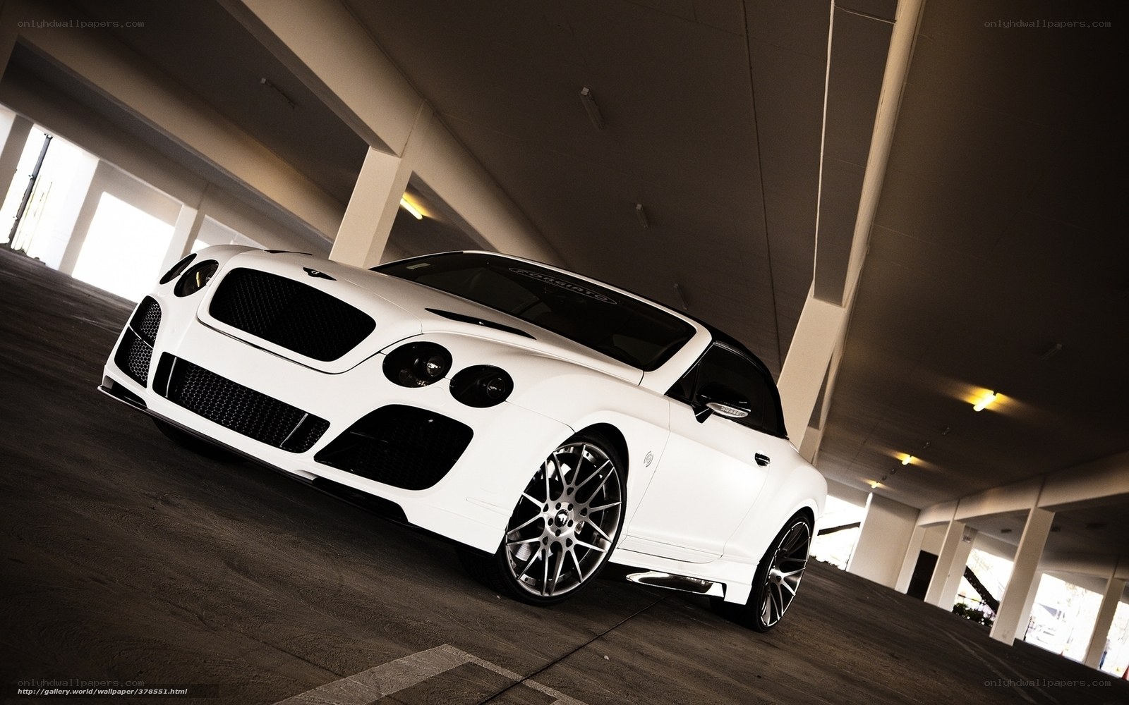 White Bentley in parking garage