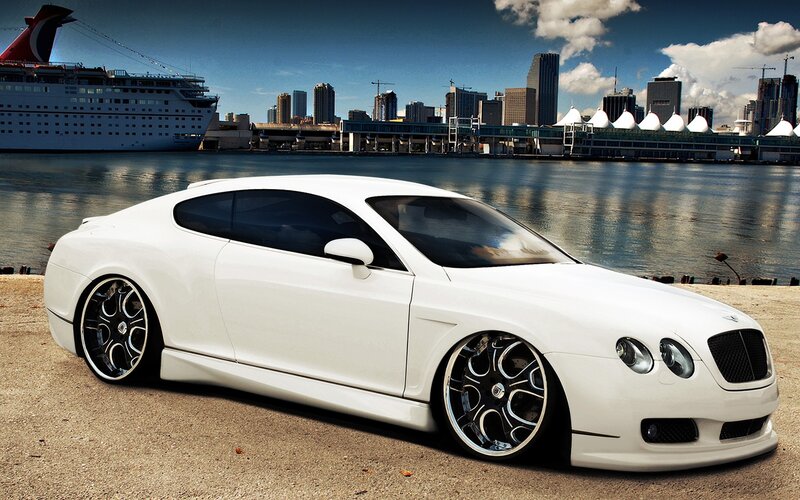 White Bentley near cruise ship