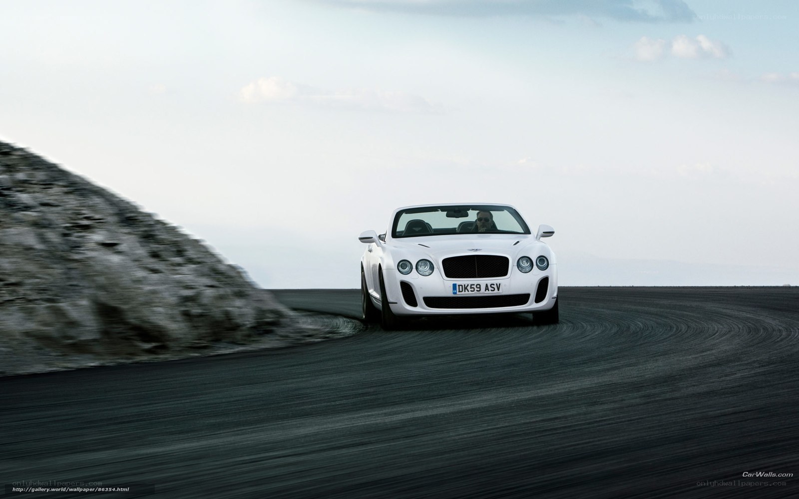 White Bentley on a winding road