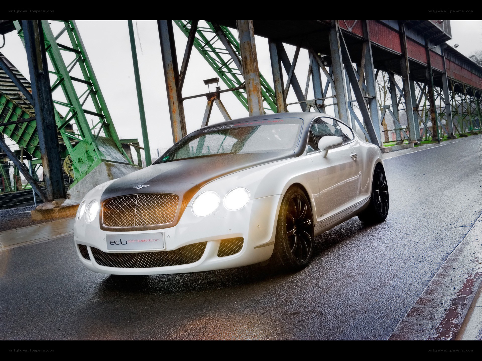White Bentley on wet road