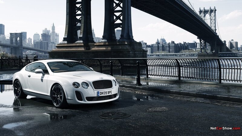 White Bentley parked by bridge