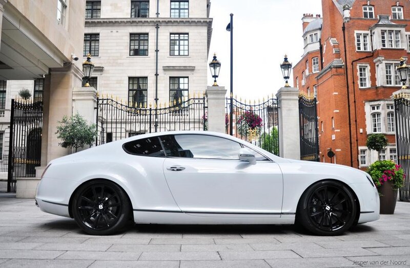 White Bentley parked on street
