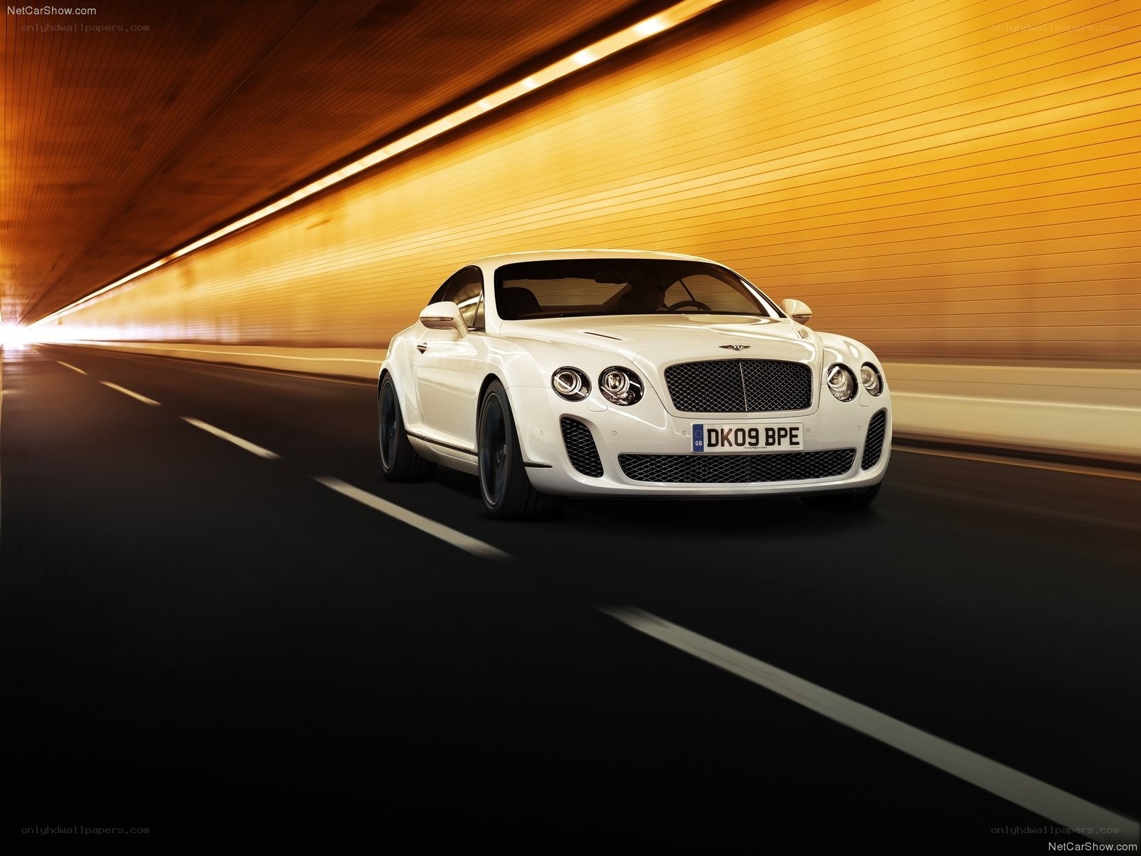 White Bentley speeding in tunnel