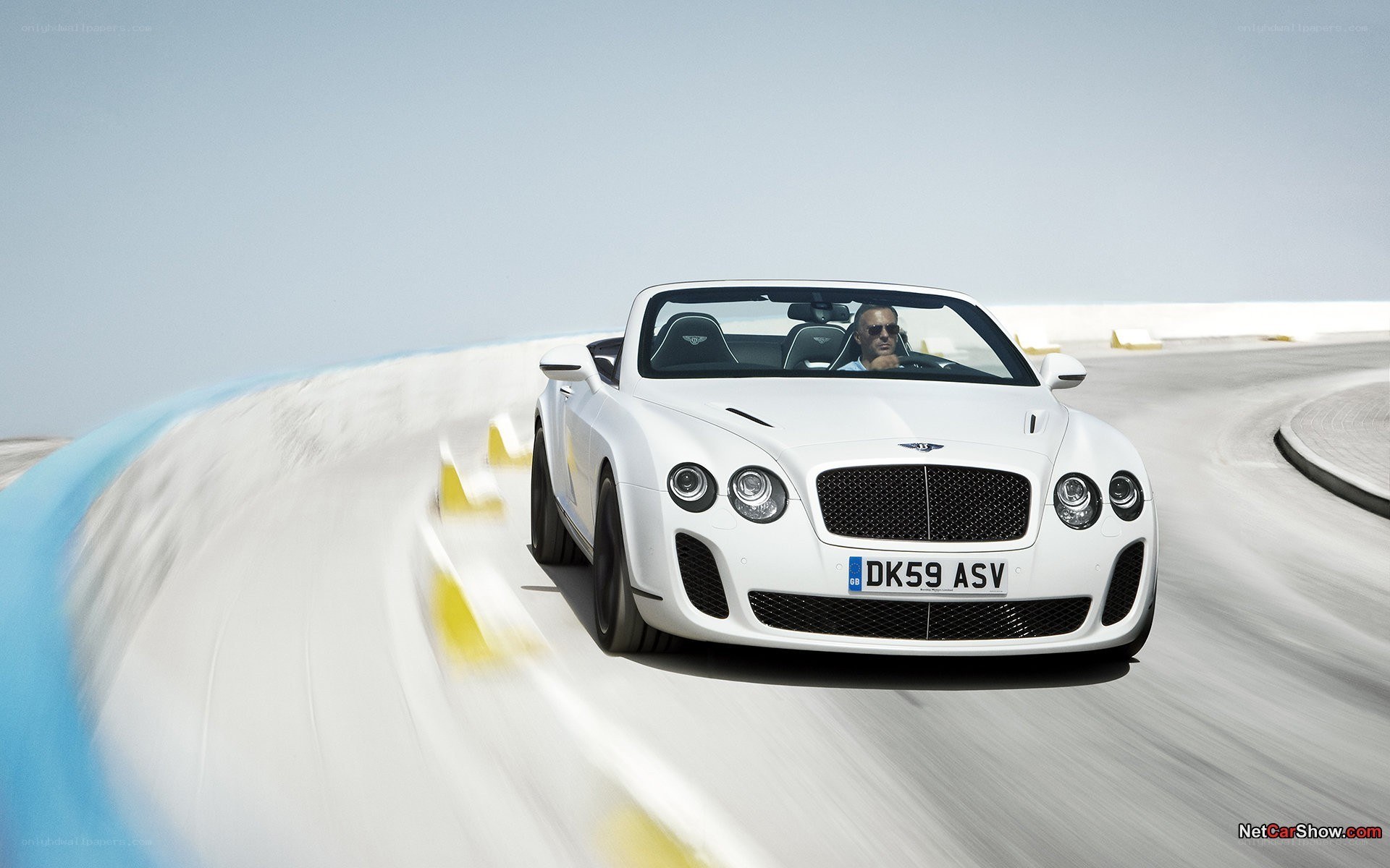 White Bentley speeding on track