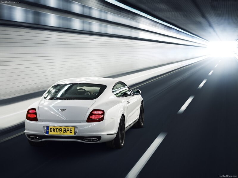 White Bentley speeding through tunnel