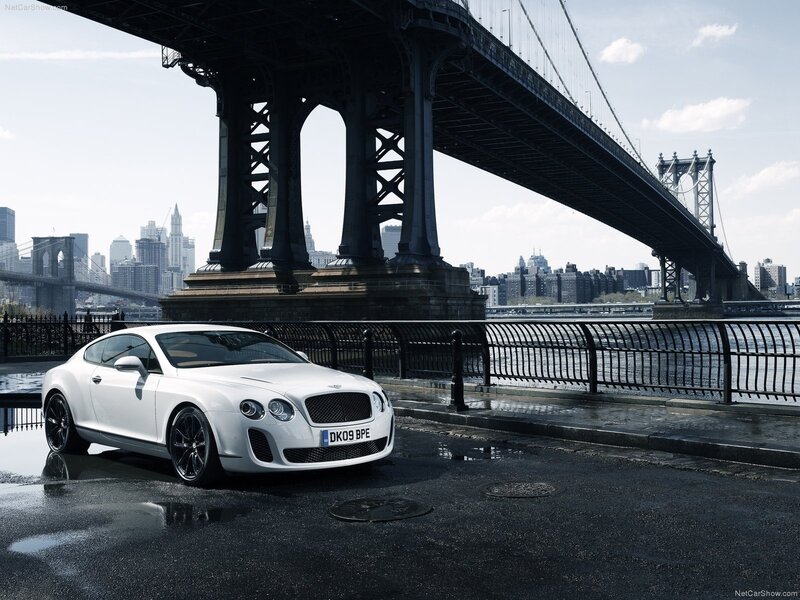 White Bentley under a bridge