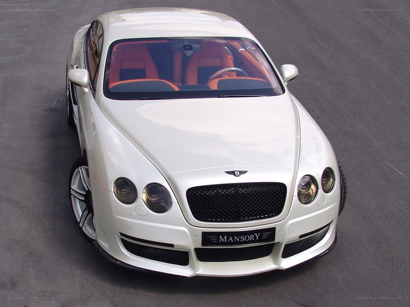 white bentley with orange interior