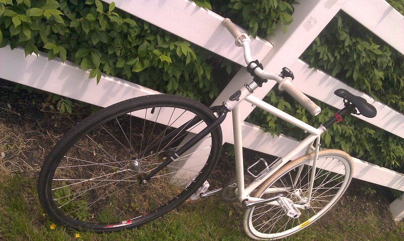 White Bicycle Against Fence — Calm
