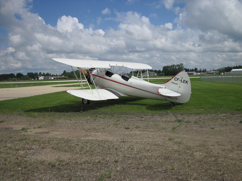 White Biplane on Grass