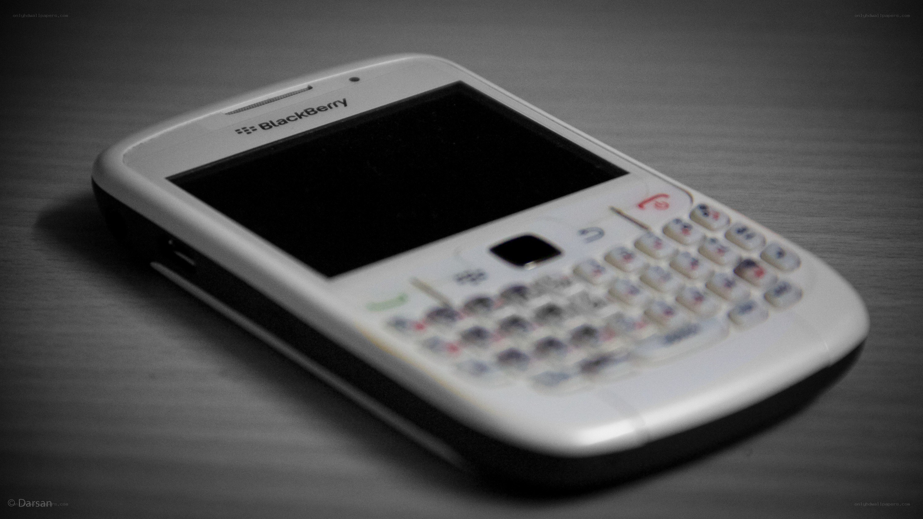 white blackberry phone on table
