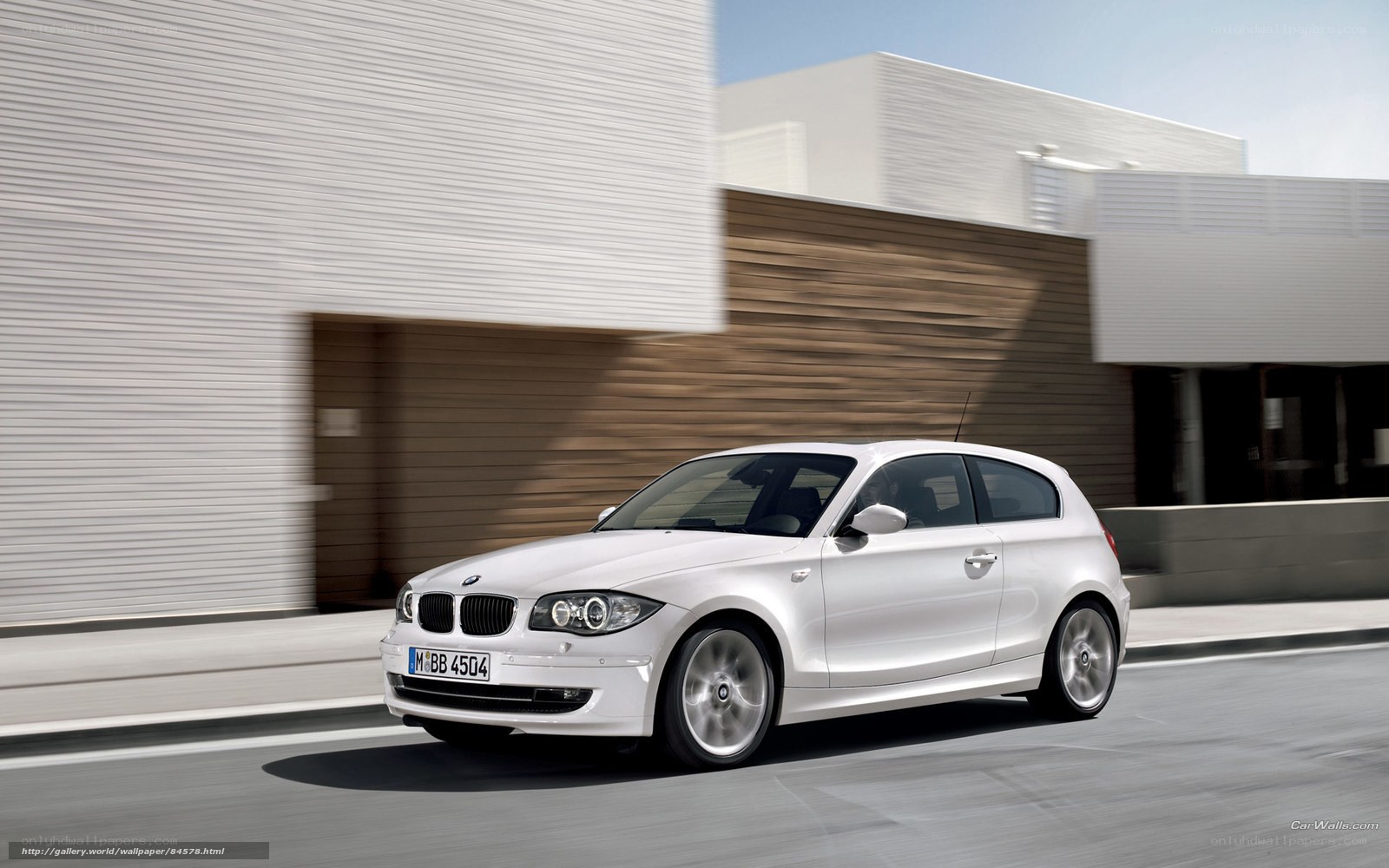 White BMW 1 Series in motion