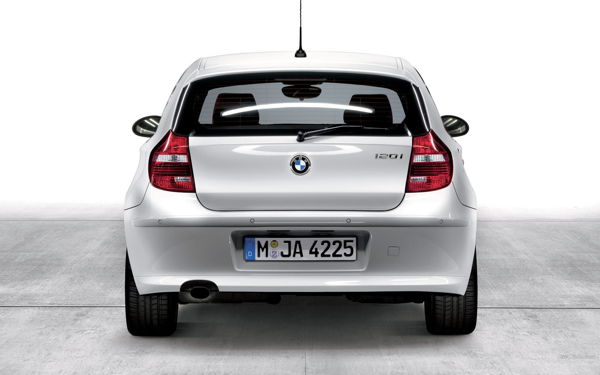 white bmw 120i rear view